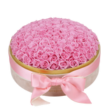 Couple gifting Floragram 100 pink preserved roses — romantic gift Canada