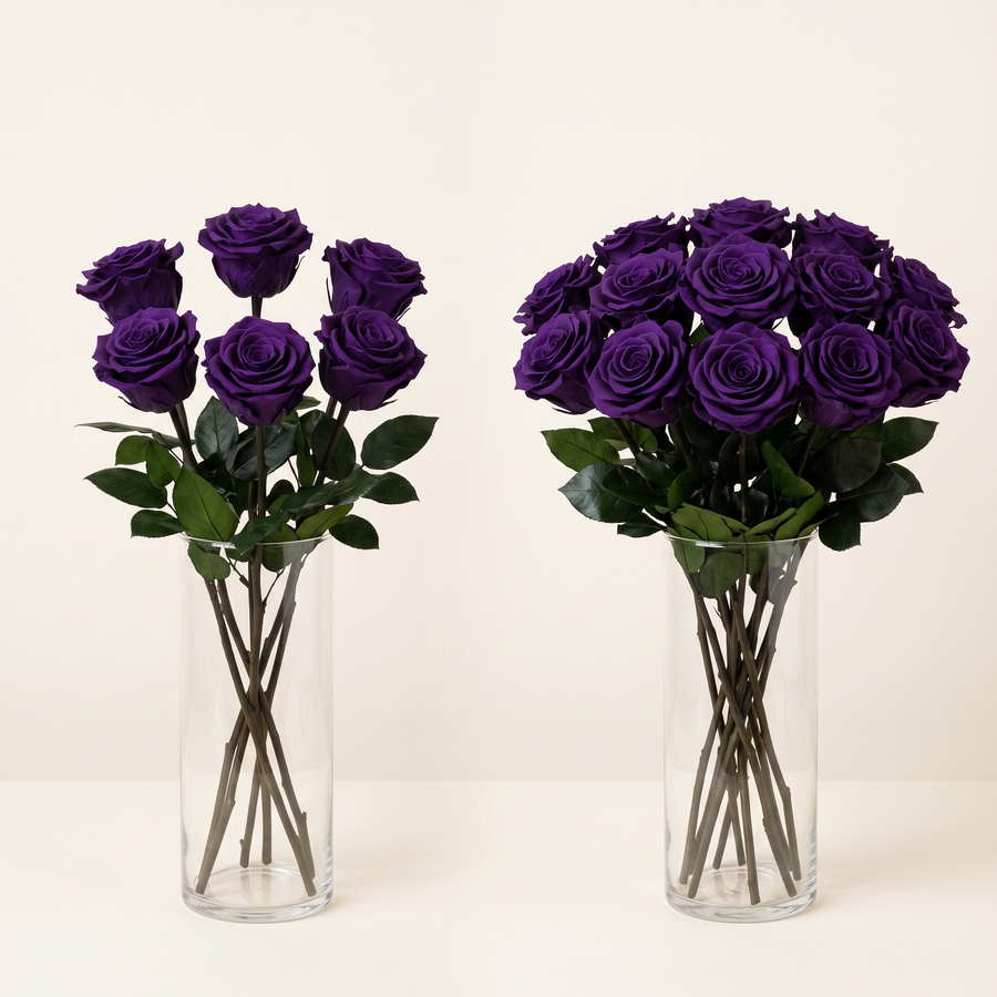Purple long stem preserved roses arranged in a glass vase